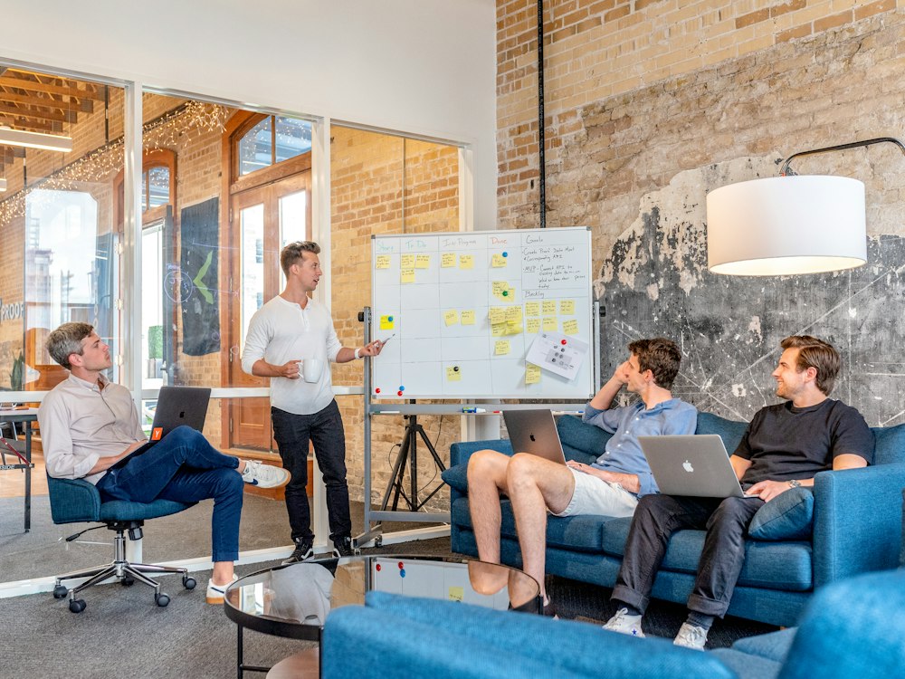 Professional consumer insurance analysts reviewing transparent policy options in an editorial meeting